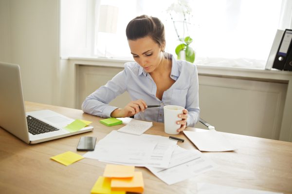Accountant working documents on desk
