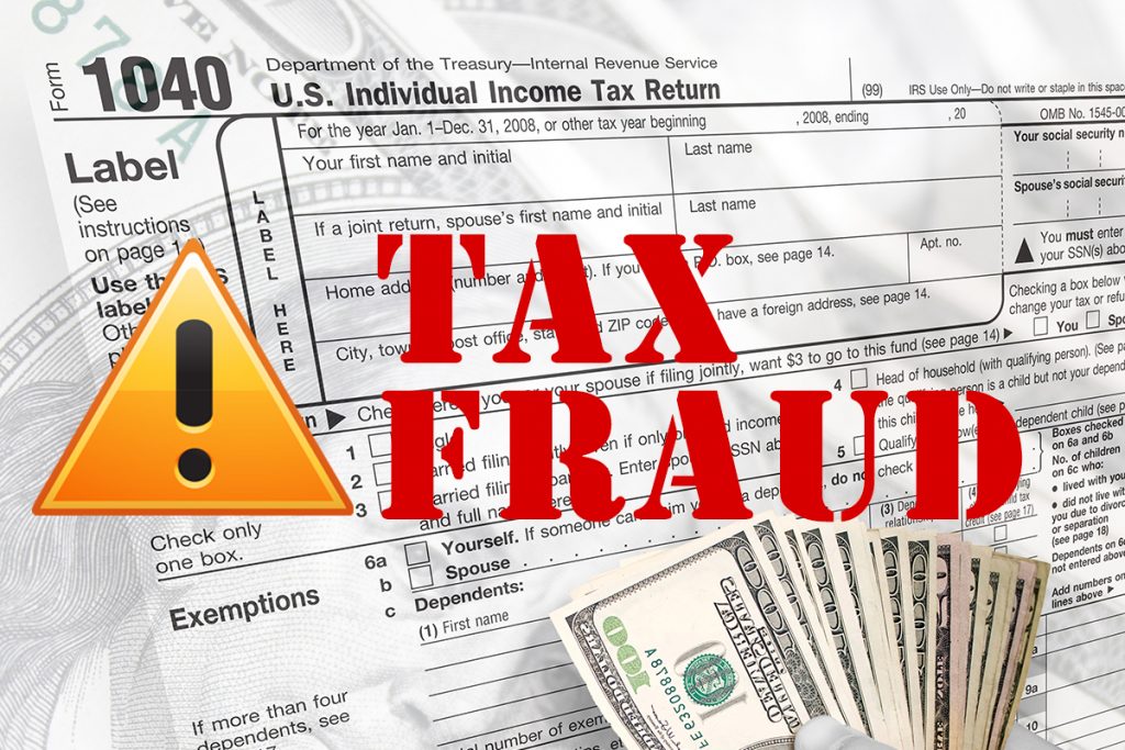 Tax Fraud in red letters over a tax document